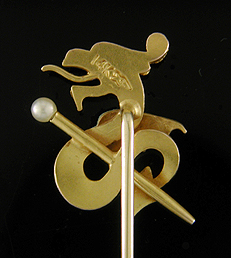 Stickpin with a fiery dragon protecting a golden sceptre. (J9055)