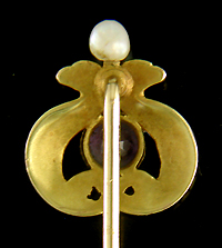 Antique stickpin of entwined serpents guarding an amethyst. (J9083)