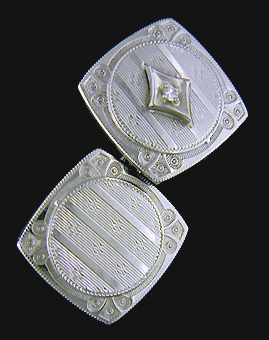 Antique white gold and diamond cufflinks. (J8610)