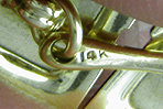 Close-up of gold purity mark ('14K'). (J8841) 