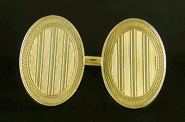 Elegantly engraved cufflinks crafted in 14kt yellow gold. (J7221)