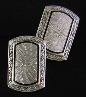 Charles Keller platinum and gold cufflinks with black enamel accents. (J8716)