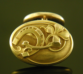 Larter Art Nouveau lucky cufflinks crafted in 14kt gold. (9533)