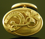 Larter Art Nouveau lucky cufflinks crafted in 14kt gold. (J9533)