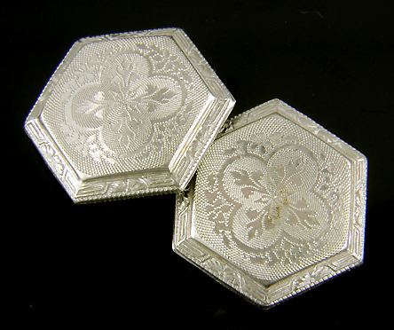 Elegantly engraved platinum and gold cufflinks. (J9118)