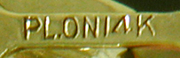 Close-up of platinum on gold precious metal mark. (J9333)