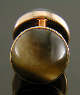Sansbury & Nellis Tiger Eye cufflinks crafted in 14kt rose gold. (J9112)