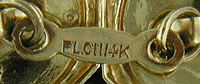 Close up of platinum on gold precious metal mark. (J8736)