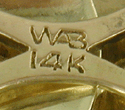 Close up of precious metal mark and WAB hallmark.