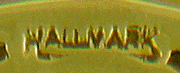 Close up of United Jewelers maker's mark. (J9322)