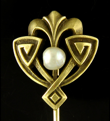 Egyptian Revival stickpin set with a luminous pearl. (J9033)