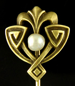 Egyptian Revival stickpin set with a luminous pearl. (J9033)